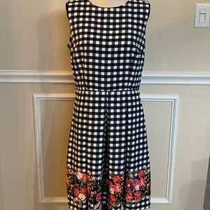 R&K Sleeveless Black/White Checkered Dress w/floral design near hem.